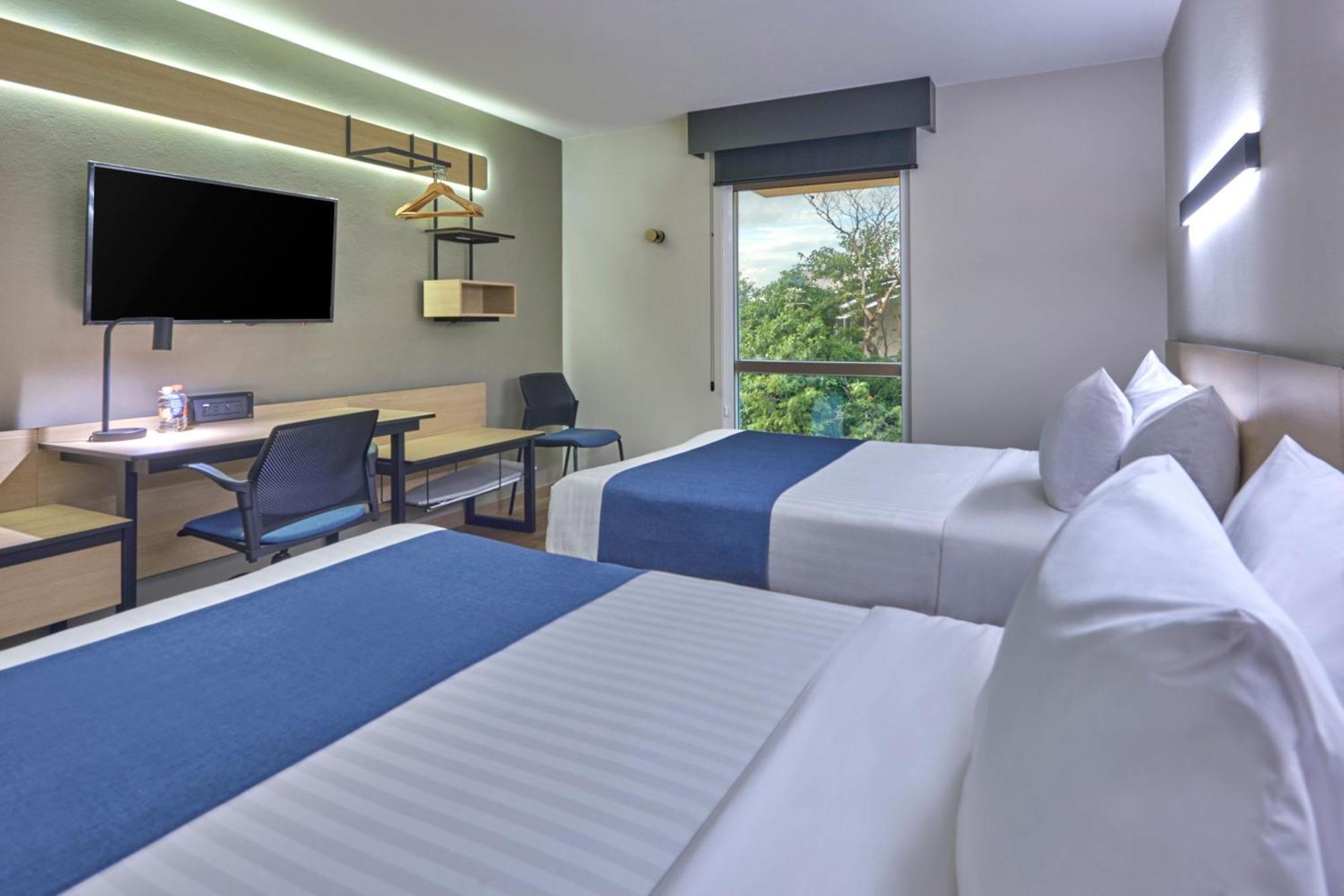 Quarto Duplo com 2 Camas de Casal